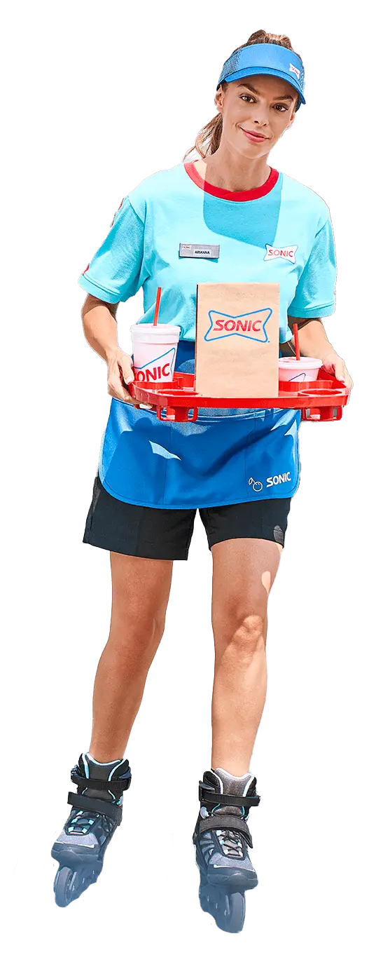 Waitress on roller skates serving fast food from a drive-in restaurant franchise.